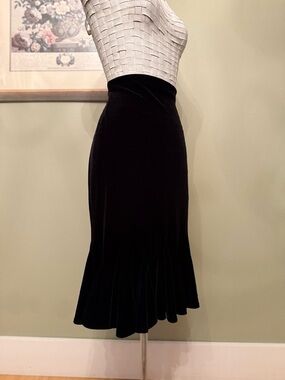JS Collections black High-waisted midi/maxi length with a mermaid/trumpet flare.